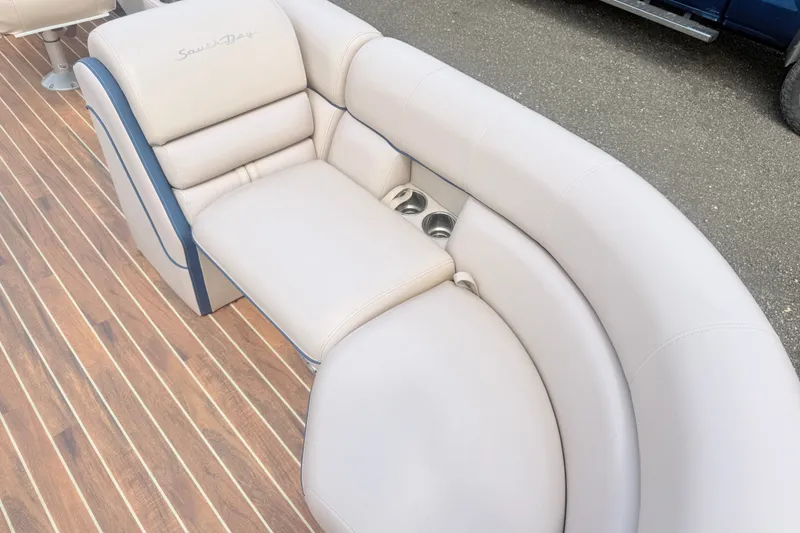 Slide: The Image of Luxurious seating on 2017 South Bay 500 boat with cup holders and wood-style flooring. - 7
