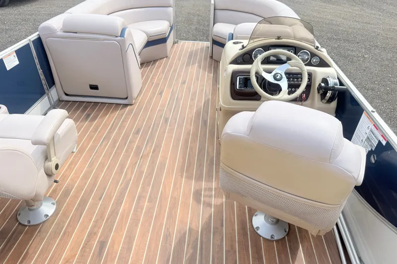 Slide: The Image of 2017 South Bay 500 boat interior with plush seating and modern steering console. - 5
