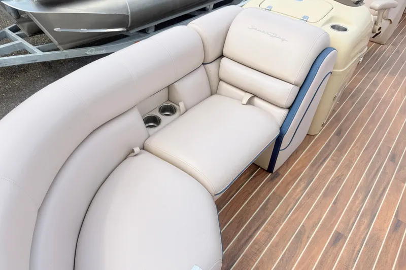 Slide: The Image of Luxurious seating on 2017 South Bay 500 boat with cup holders and wood-style flooring. - 6