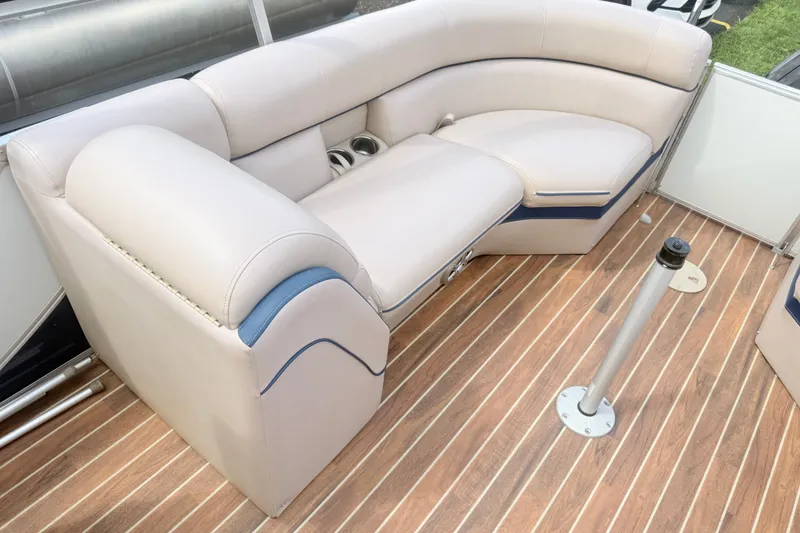 Slide: The Image of Luxurious seating on a 2017 South Bay 500 pontoon boat with wood-style flooring. - 12