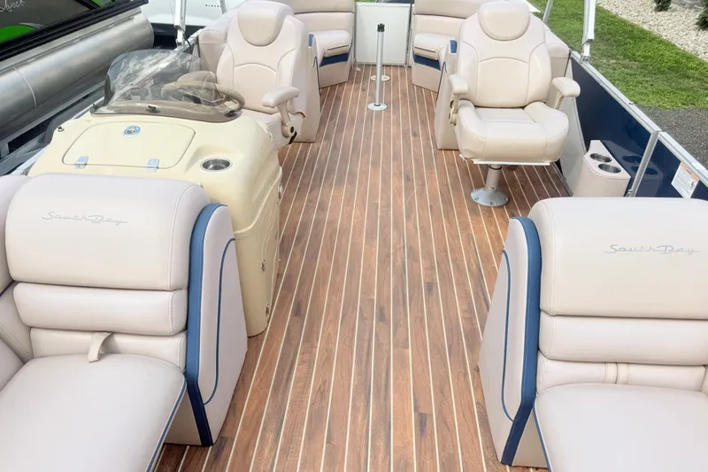 Slide: The Image of 2017 South Bay 500 boat interior with plush seating and wood-style flooring. - 8