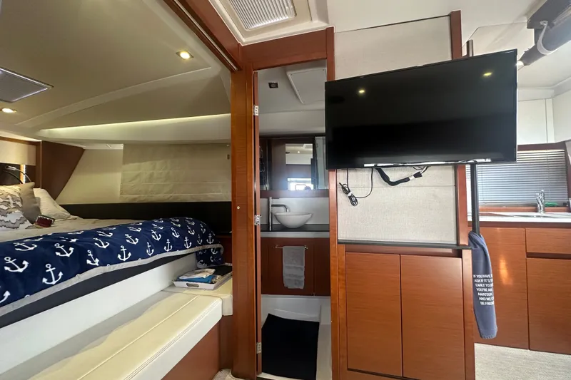 Slide: The Image of Interior of 2015 Jeanneau Leader 40 yacht with cozy bedroom and modern amenities. - 32