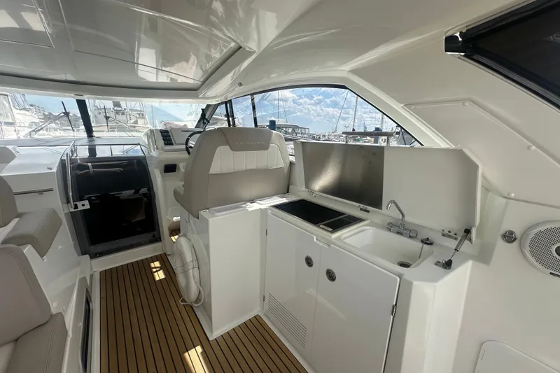Slide: The Image of Interior of 2015 Jeanneau Leader 40 yacht with helm, sink, and seating area. - 18