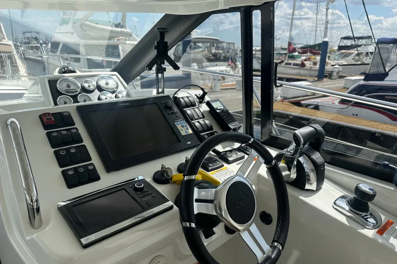 Slide: The Image of Cockpit of 2015 Jeanneau Leader 40 yacht with navigation controls and steering wheel. - 25