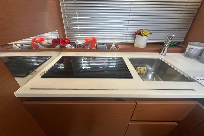 Slide: The Image of Modern kitchen area in a 2015 Jeanneau Leader 40 yacht with stove and sink. - 33
