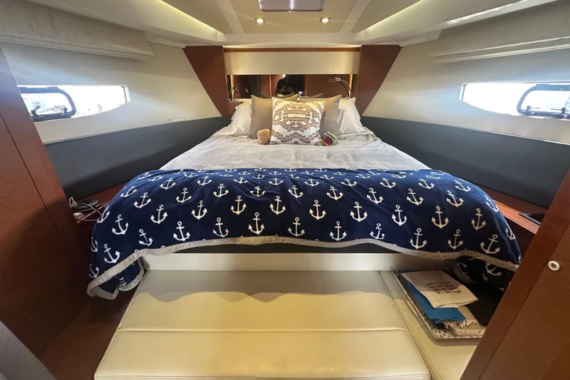 Slide: The Image of Luxurious cabin interior of 2015 Jeanneau Leader 40 yacht with nautical-themed bedding. - 30