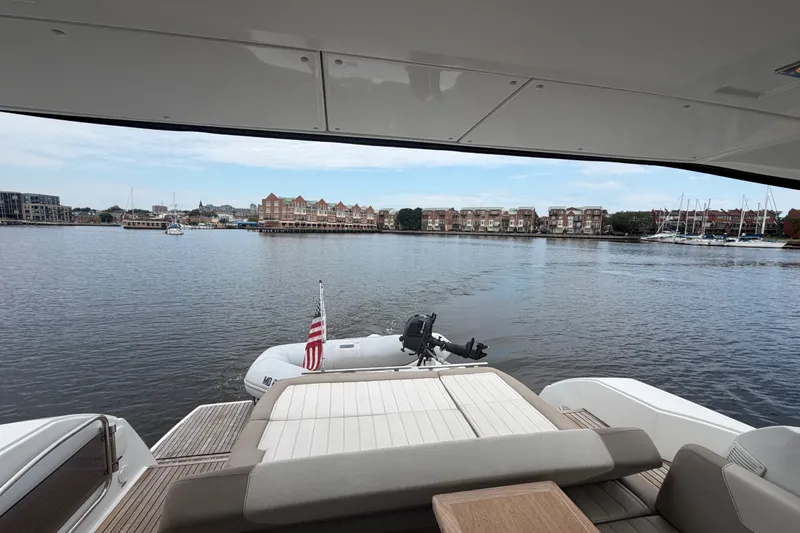 Slide: The Image of View from Jeanneau Leader 40 yacht, overlooking serene waterfront and distant buildings. - 13