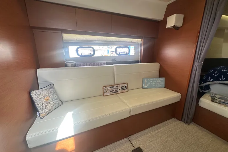 Slide: The Image of Interior of 2015 Jeanneau Leader 40 yacht with cozy seating and nautical decor. - 34