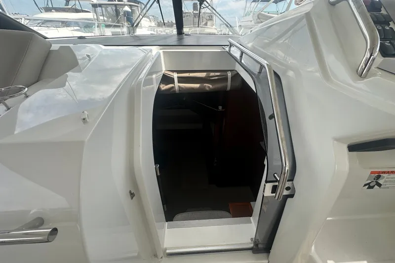 Slide: The Image of Entrance to cabin of 2015 Jeanneau Leader 40 yacht, featuring sleek white design. - 29