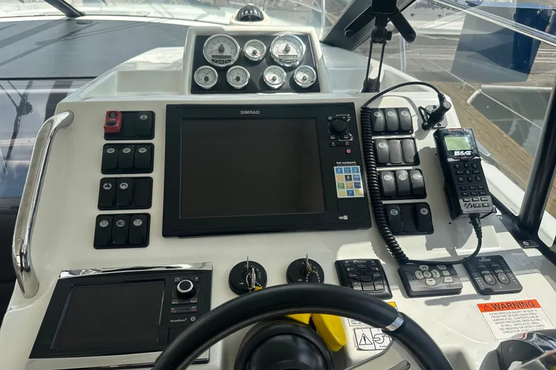 Slide: The Image of Helm of 2015 Jeanneau Leader 40 with navigation controls and instruments. - 26
