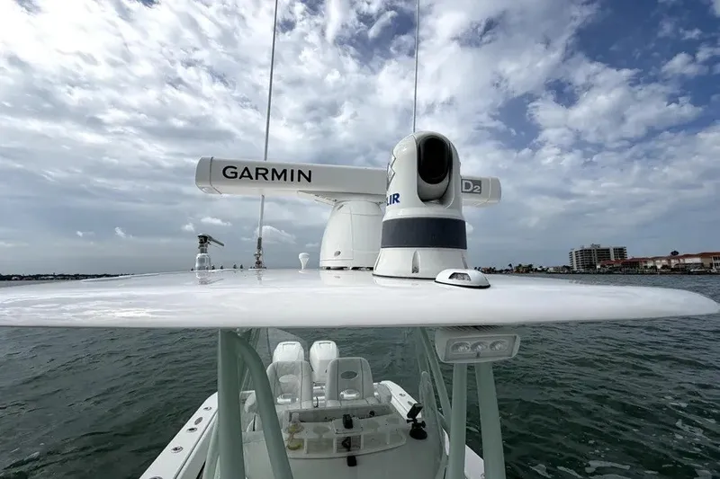 Slide: The Image of 2019 Contender 30 ST boat with Garmin radar and clear sky background. - 19