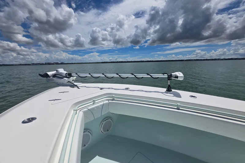 Slide: The Image of 2019 Contender 30 ST boat on water under cloudy sky. - 63