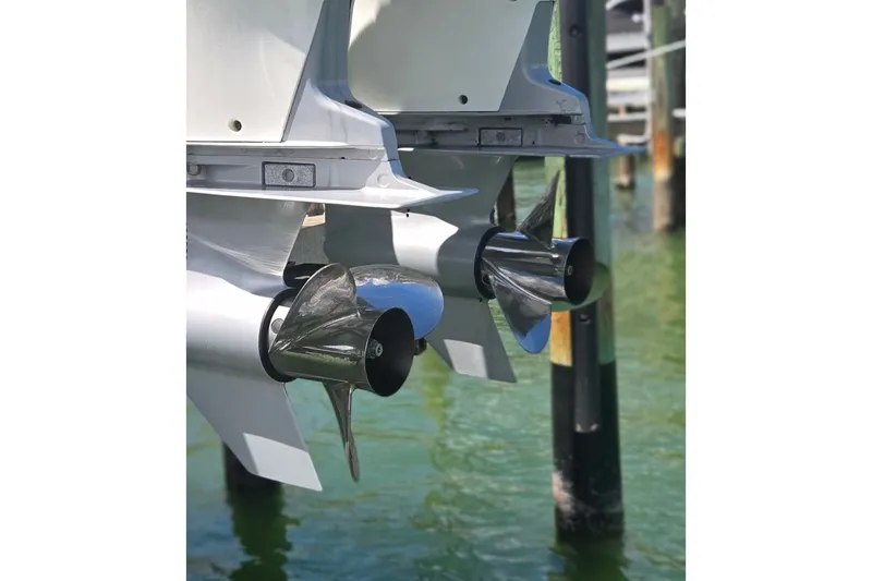 Slide: The Image of Twin propellers of a 2019 Contender 30 ST boat in clear water. - 21