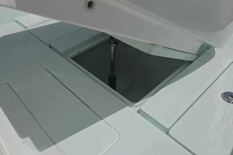 Slide: The Image of Open storage compartment on a 2019 Contender 30 ST boat deck. - 36