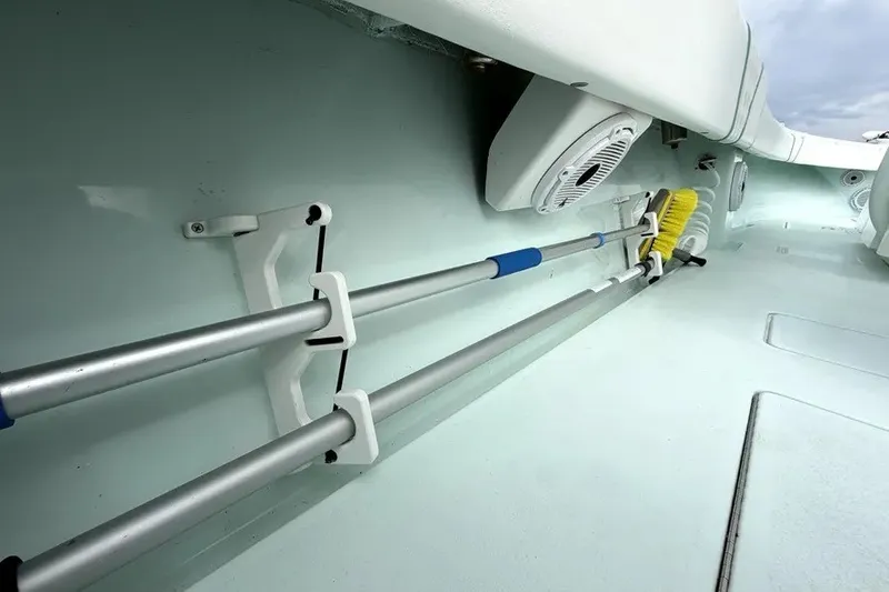 Slide: The Image of 2019 Contender 30 ST boat interior with mounted cleaning tools and speaker. - 18