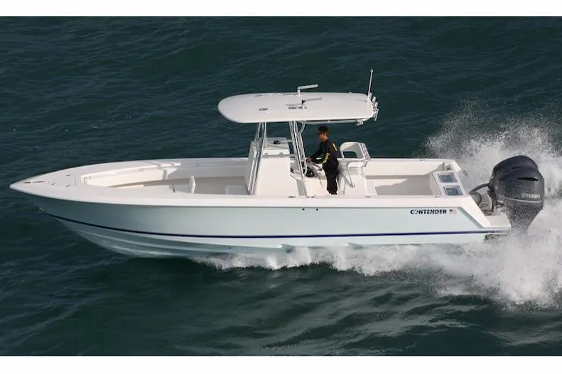 Slide: The Image of Manufacturer Provided Image: 2019 Contender 30 ST boat cruising on water. - 2