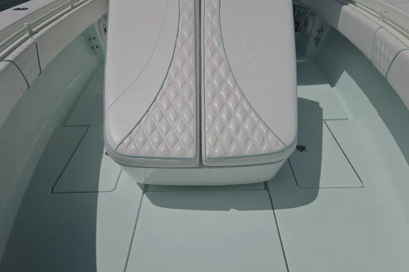 Slide: The Image of 2019 Contender 30 ST boat interior with diamond-stitched white seating. - 35