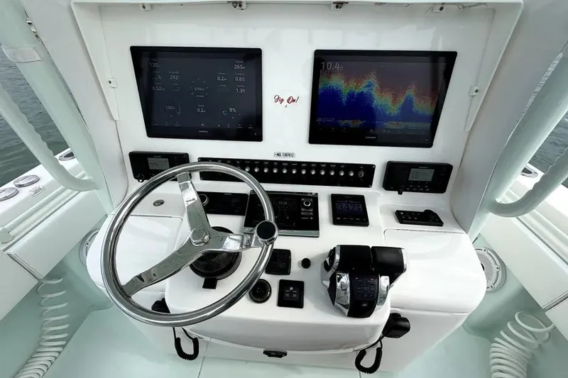 Slide: The Image of Helm of 2019 Contender 30 ST boat with dual displays and controls. - 7