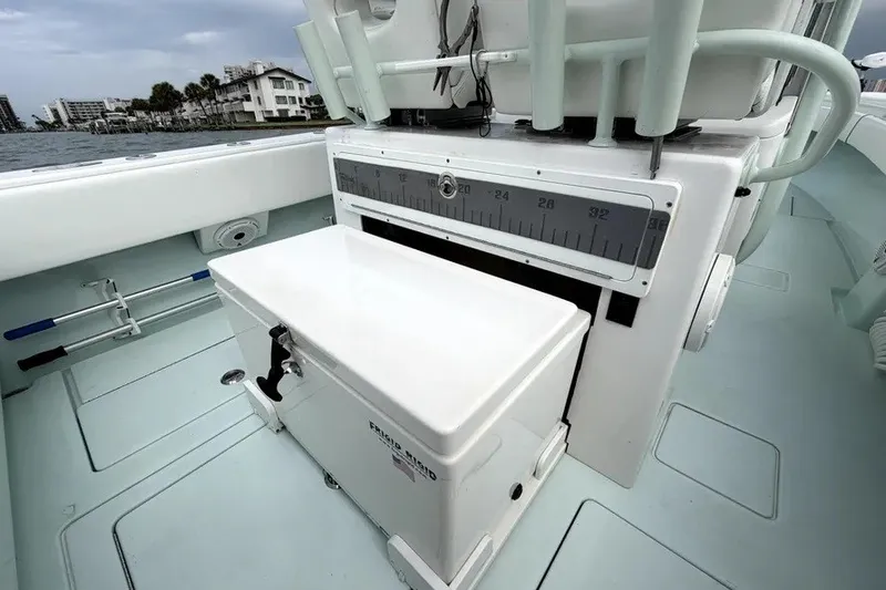 Slide: The Image of 2019 Contender 30 ST boat interior with storage and measuring scale. - 11