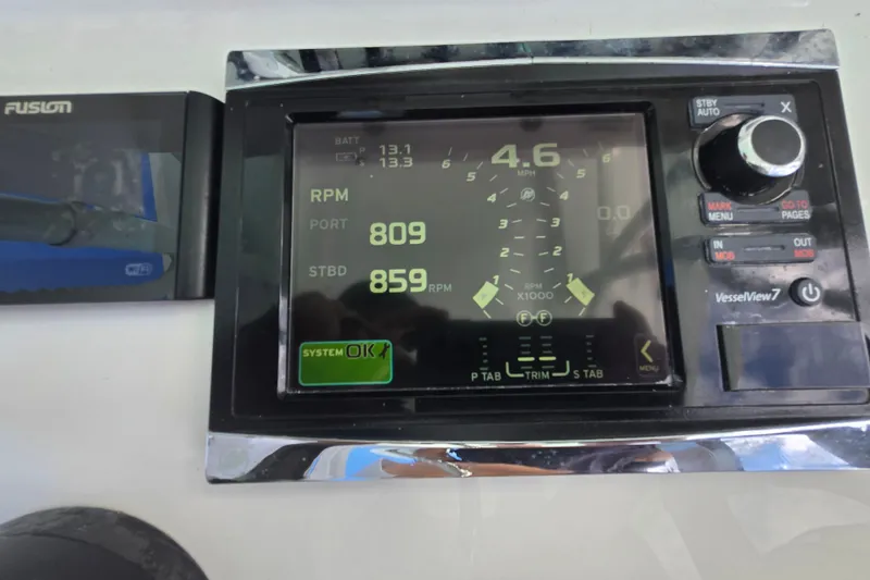 Slide: The Image of Dashboard of a 2019 Contender 30 ST boat showing RPM and speed metrics. - 45