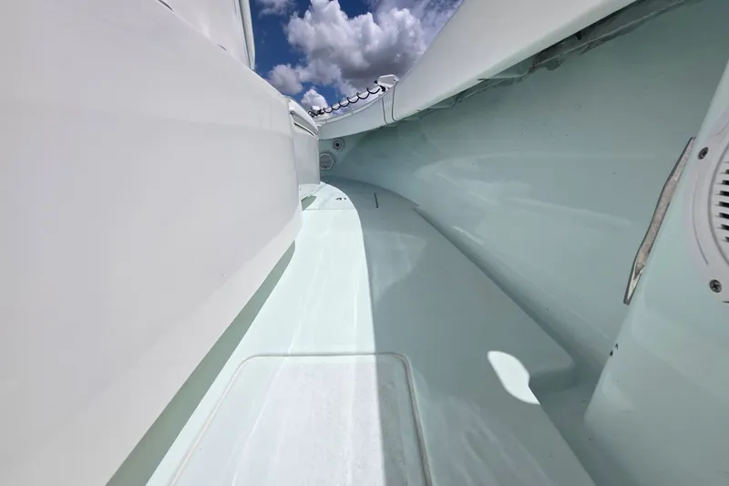 Slide: The Image of 2019 Contender 30 ST boat interior with sleek design and clear sky view. - 60