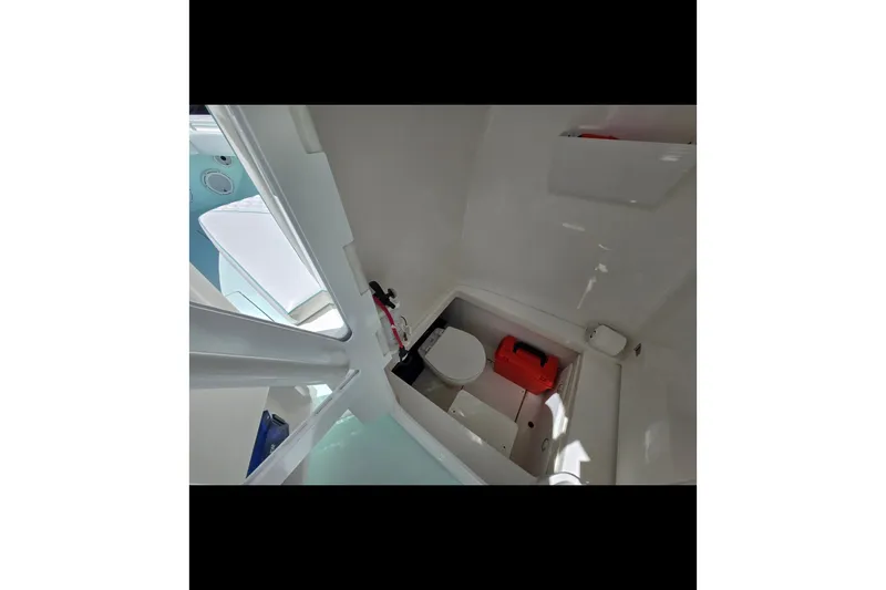 Slide: The Image of Interior of 2019 Contender 30 ST boat featuring compact bathroom amenities. - 68