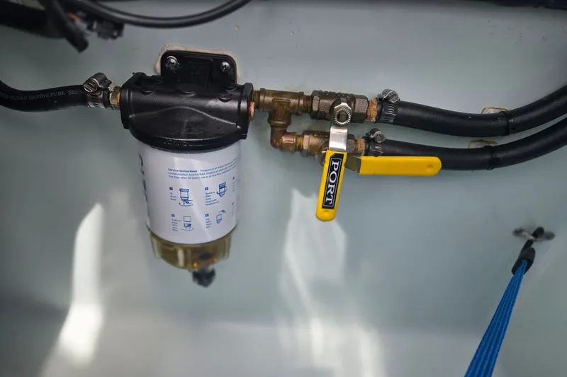 Slide: The Image of Fuel filter system in a 2019 Contender 30 ST boat with labeled port valve. - 78