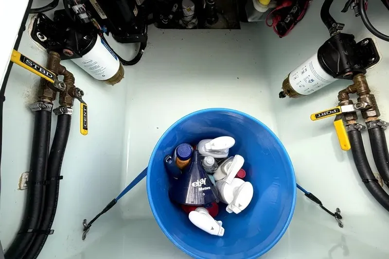Slide: The Image of Engine compartment of 2019 Contender 30 ST with filters and maintenance supplies. - 22