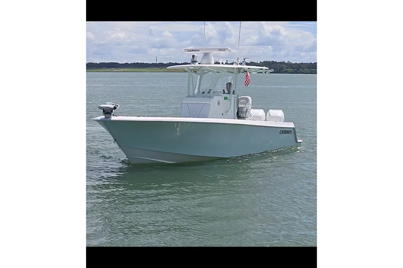 Slide: The Image of 2019 Contender 30 ST boat on calm water, featuring a sleek design and modern equipment. - 9
