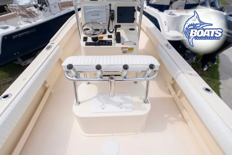Slide: The Image of 2013 Parker 2300 Special Edition boat interior with Garmin navigation system and rod holders. - 7