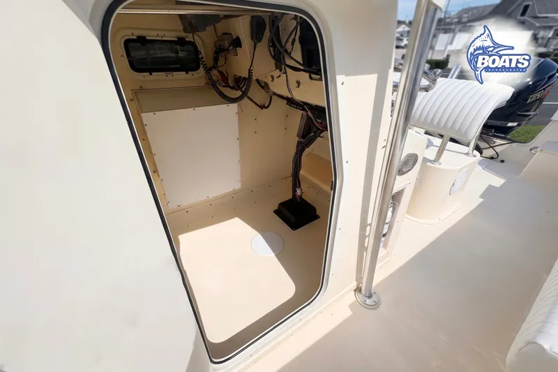 Slide: The Image of Interior view of a 2013 Parker 2300 Special Edition boat, showcasing wiring and seating. - 6