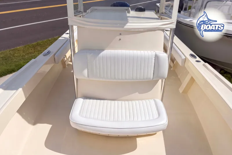 Slide: The Image of 2013 Parker 2300 Special Edition boat interior with white cushioned seating. - 3