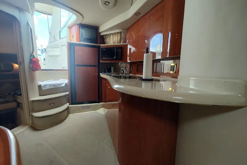Slide: The Image of Interior of 2000 Sea Ray Sundancer 400 yacht with kitchen and stairs. - 24