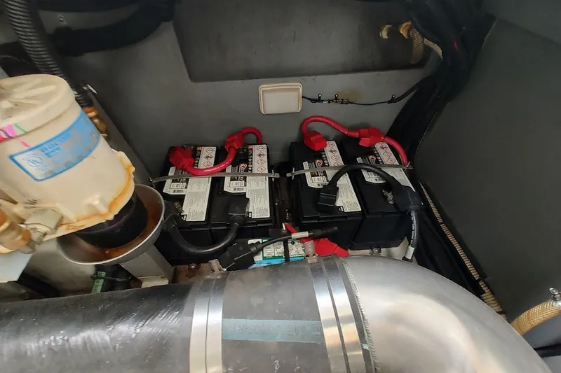 Slide: The Image of Engine compartment of 2000 Sea Ray Sundancer 400 with batteries and wiring. - 33