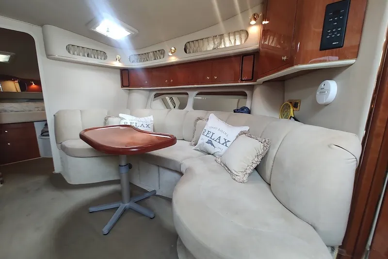 Slide: The Image of Interior of 2000 Sea Ray Sundancer 400 yacht with cozy seating and elegant wood finishes. - 27