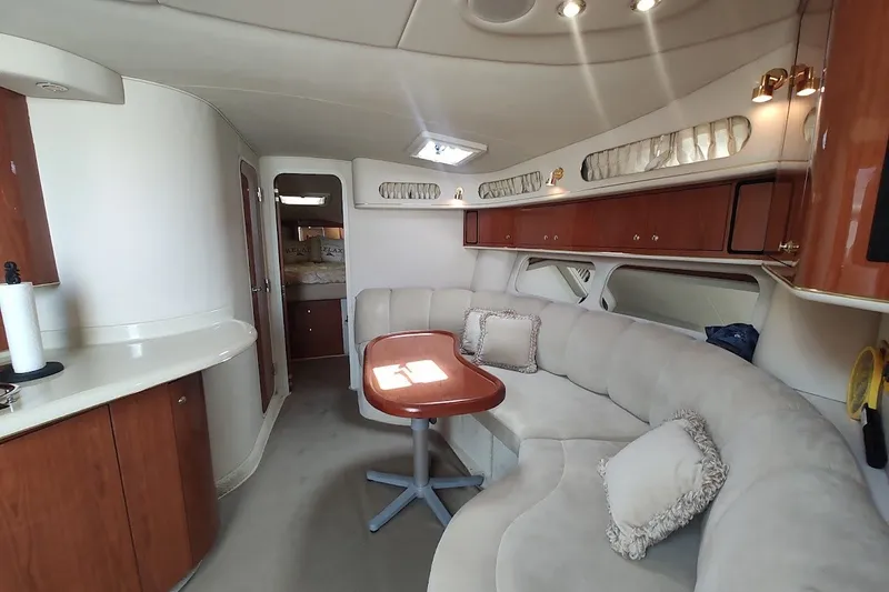 Slide: The Image of Luxurious interior of 2000 Sea Ray Sundancer 400 yacht with plush seating and elegant wood finishes. - 19