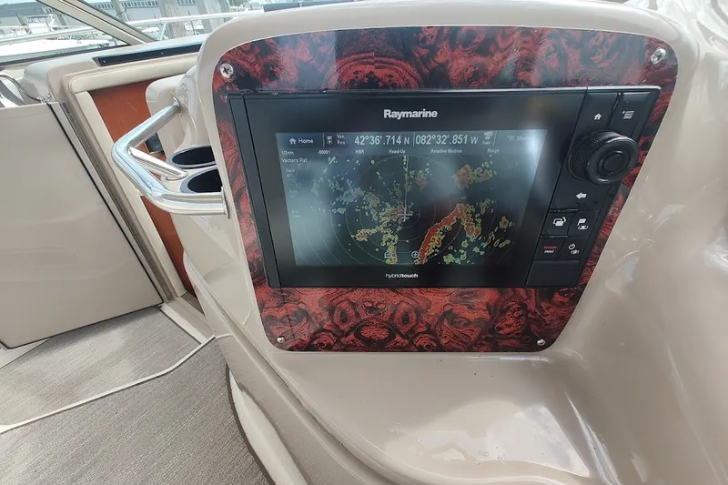 Slide: The Image of Raymarine navigation system on 2000 Sea Ray Sundancer 400 yacht dashboard. - 16