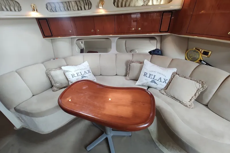 Slide: The Image of Luxurious interior of 2000 Sea Ray Sundancer 400 yacht with plush seating and wooden table. - 20