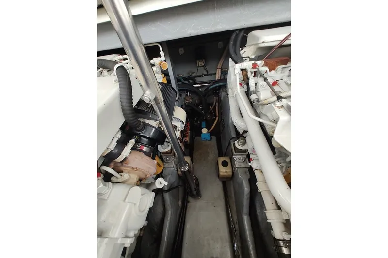 Slide: The Image of Engine compartment of a 2000 Sea Ray Sundancer 400 boat, showcasing mechanical components. - 32
