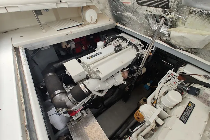 Slide: The Image of Engine compartment of a 2000 Sea Ray Sundancer 400 yacht, featuring Caterpillar engines. - 29
