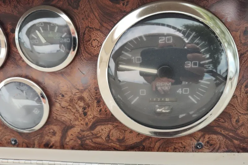 Slide: The Image of Dashboard gauges of a 2000 Sea Ray Sundancer 400 boat. - 38