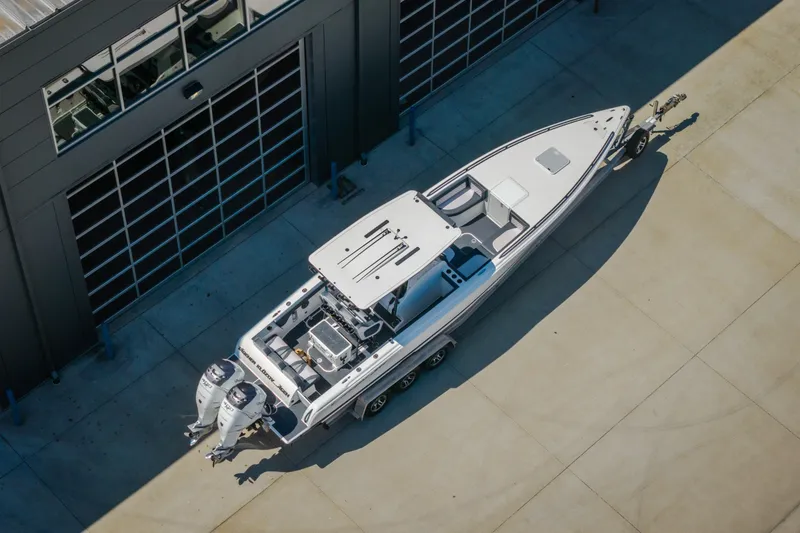 Slide: The Image of Aerial view of 2019 Concept 36' Cuddy Cabin boat on trailer near building. - 57