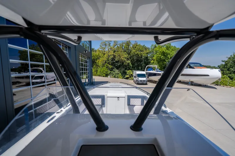 Slide: The Image of 2019 Concept 36' Cuddy Cabin boat at marina, surrounded by trees and vehicles. - 30