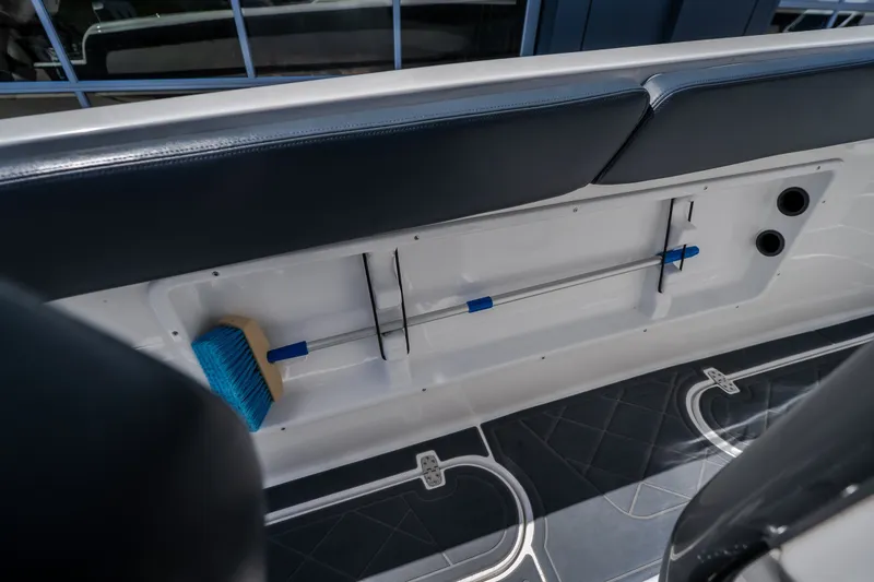 Slide: The Image of 2019 Concept 36' Cuddy Cabin boat interior with storage compartment and cleaning brush. - 33