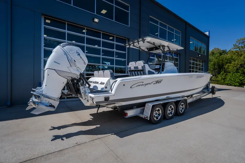 Slide: The Image of 2019 Concept 36' Cuddy Cabin boat on trailer, parked outside modern building. - 24