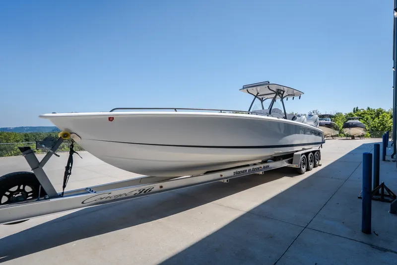 Slide: The Image of 2019 Concept 36' Cuddy Cabin boat on trailer, parked outdoors under clear blue sky. - 6