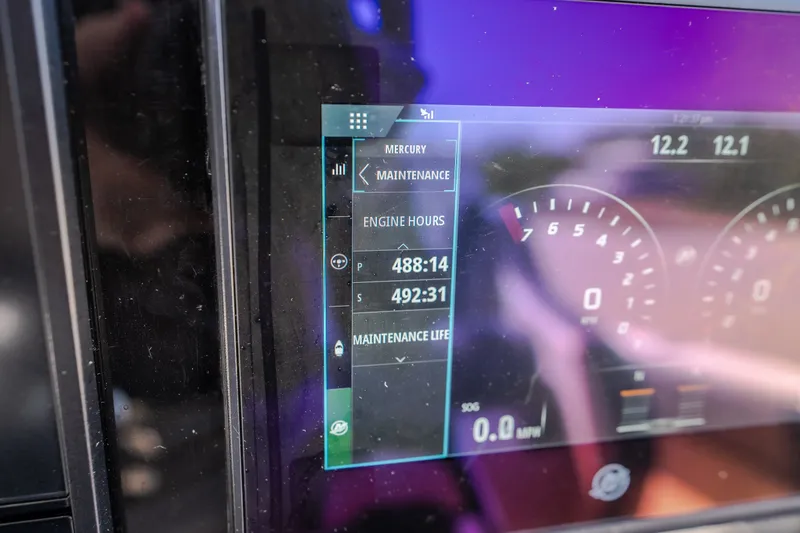 Slide: The Image of Digital dashboard of a 2019 Concept 36' Cuddy Cabin showing engine hours and maintenance data. - 47