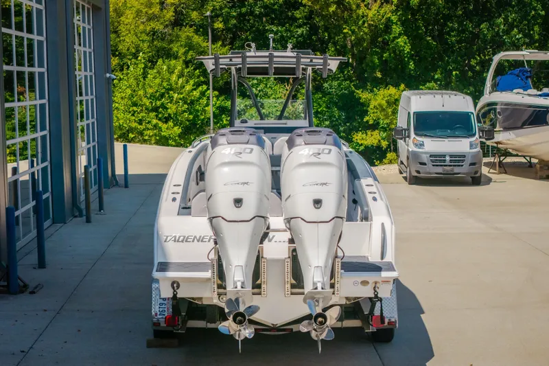 Slide: The Image of 2019 Concept 36' Cuddy Cabin boat with twin outboard engines in a marina setting. - 17