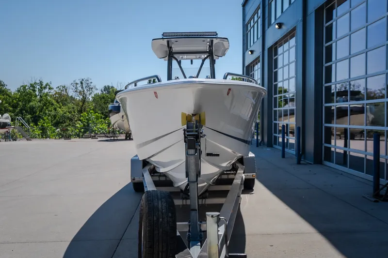 Slide: The Image of 2019 Concept 36' Cuddy Cabin boat on trailer outside modern building. - 3