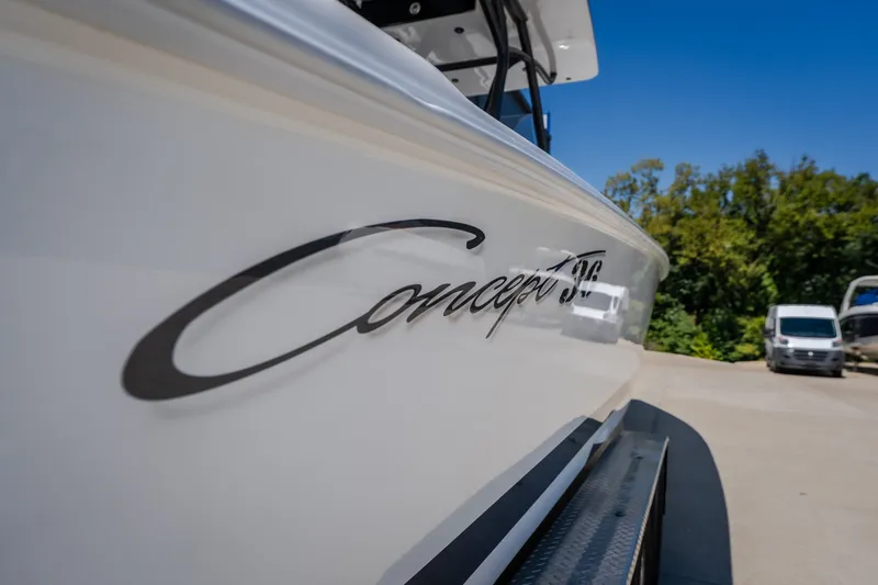 Slide: The Image of 2019 Concept 36' Cuddy Cabin boat with sleek design, parked outdoors. - 25